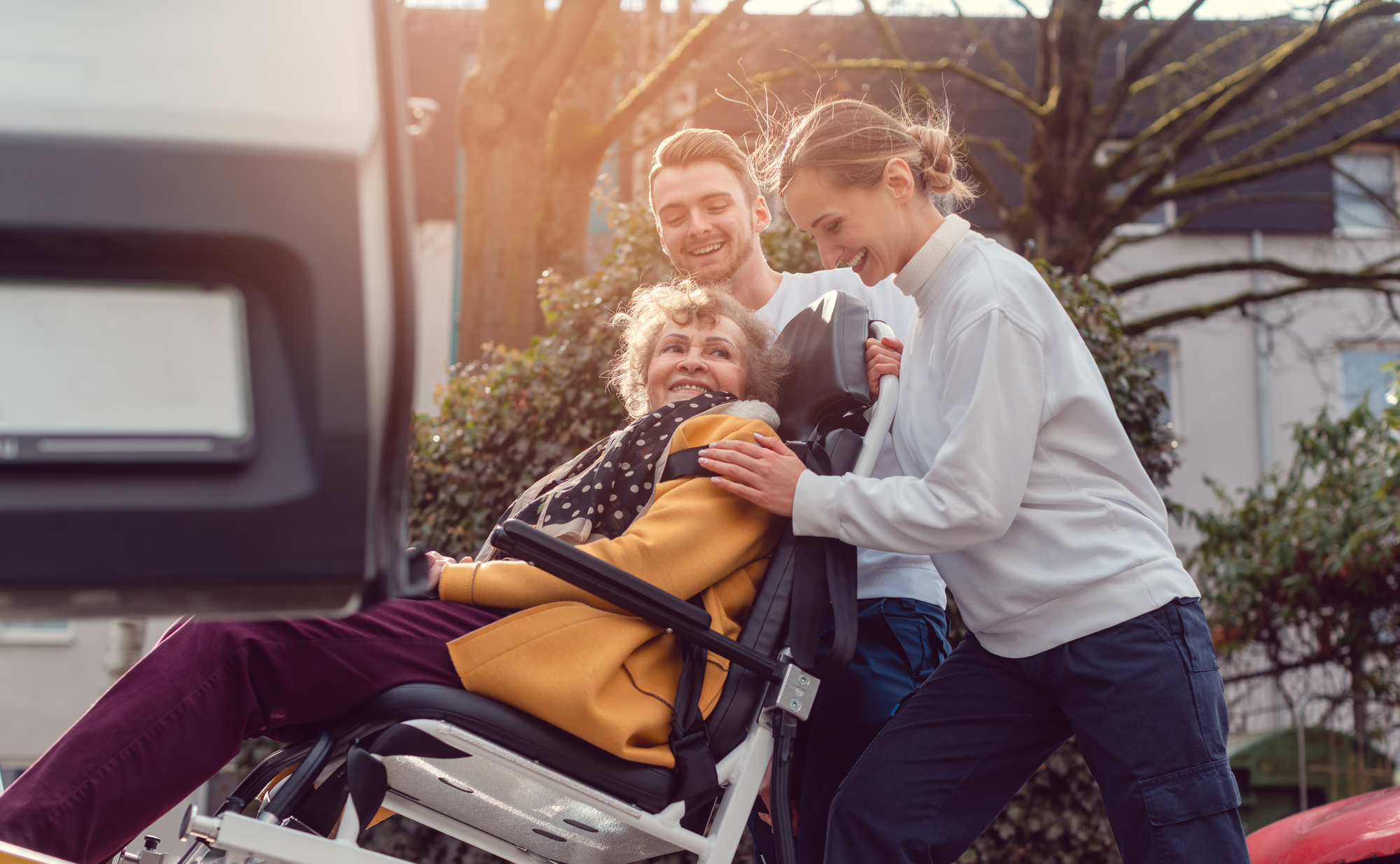 A Vehicle With a Wheelchair Lift by a Person